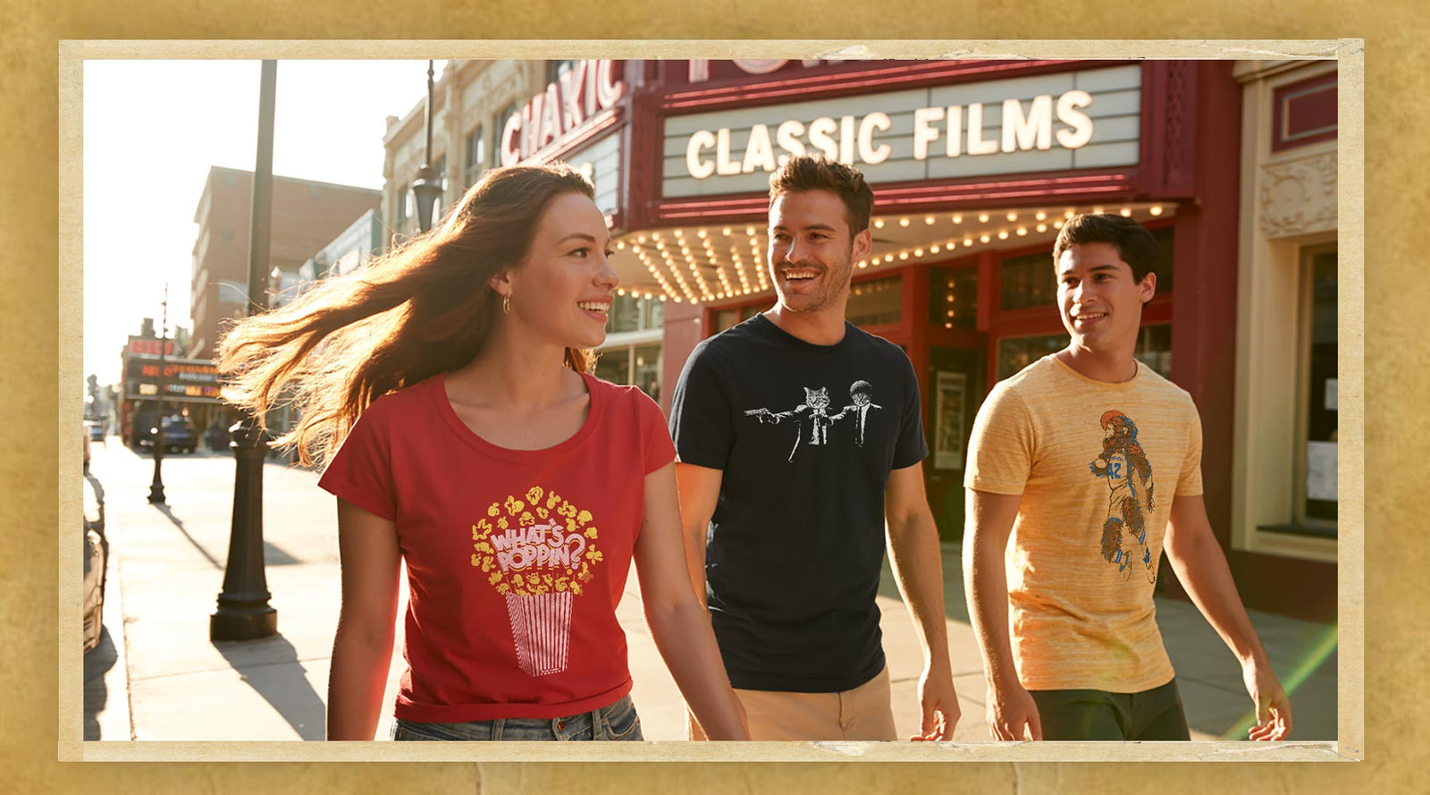 Friends wearing retro vintage movie graphic t-shirts inspired by iconic cult classics, standing outside an old-school movie theater