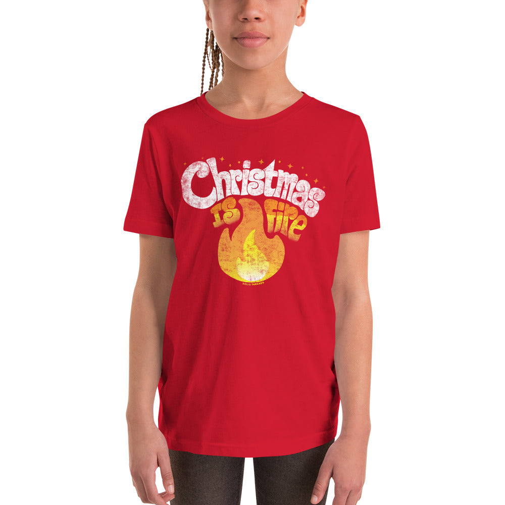 Youth Christmas Is Fire Retro Extra Soft T-Shirt | Funny Holiday Kids Tee Girl Model | Solid Threads