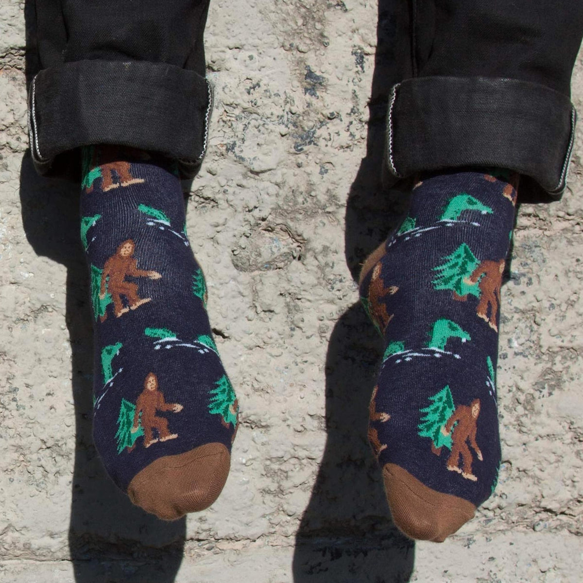 Bigfoot & Nessie Funny Woven Socks | Cool Sasquatch Cryptid  Graphic Socks on Model | Solid Threads